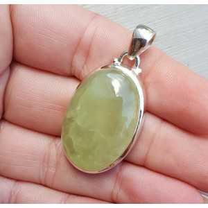 Silver pendant with oval cabochon its color