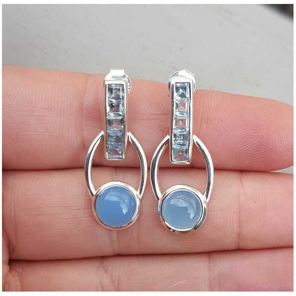 Silver earrings set with blue Topazes and Chalcedony