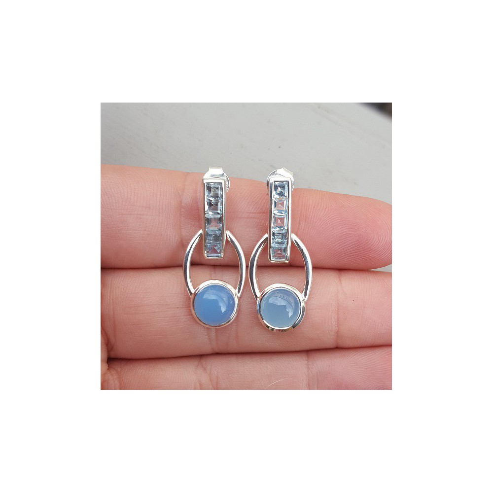 Silver earrings set with blue Topazes and Chalcedony