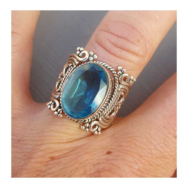 Silver ring set with blue Topaz 17.5