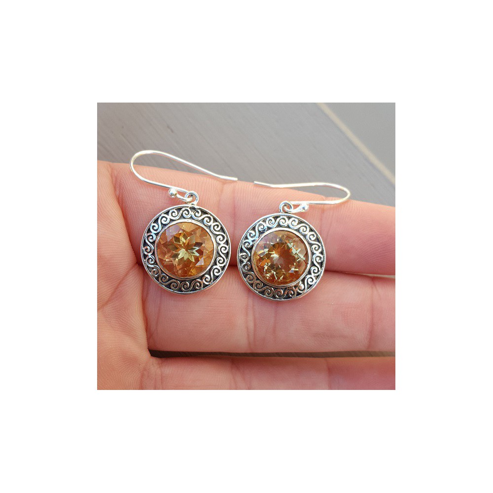 Silver earrings set with round Citrine