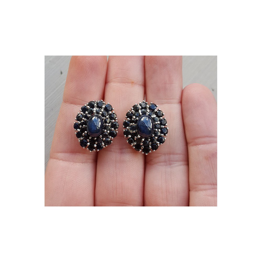 Silver earrings set with star Sapphire and round Sapphires