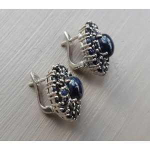 Silver earrings set with star Sapphire and round Sapphires