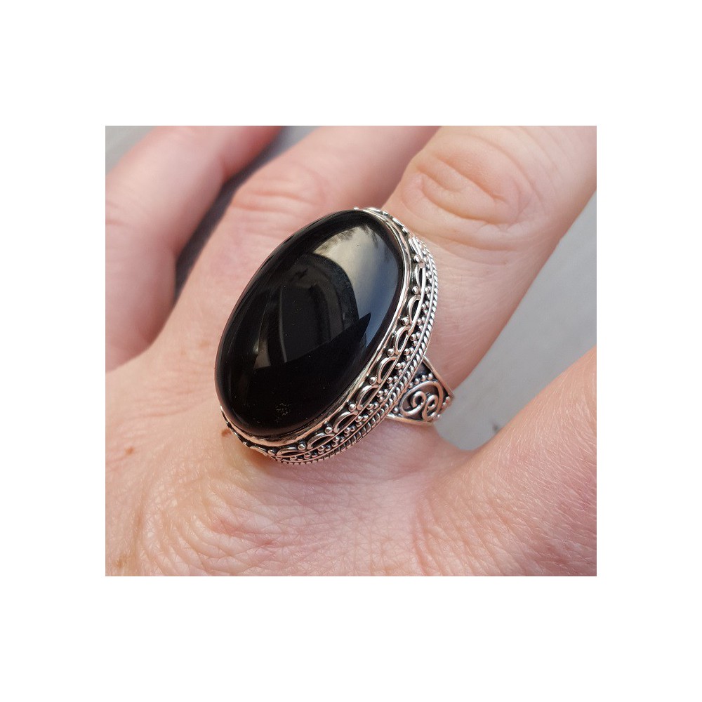 Silver ring with cabochon Onyx and carved head 18.5