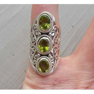 Silver ring set with Peridot and open worked band 16.5