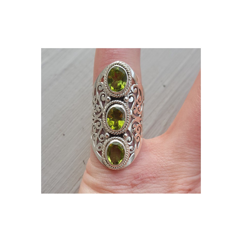 Silver ring set with Peridot and open worked band 16.5