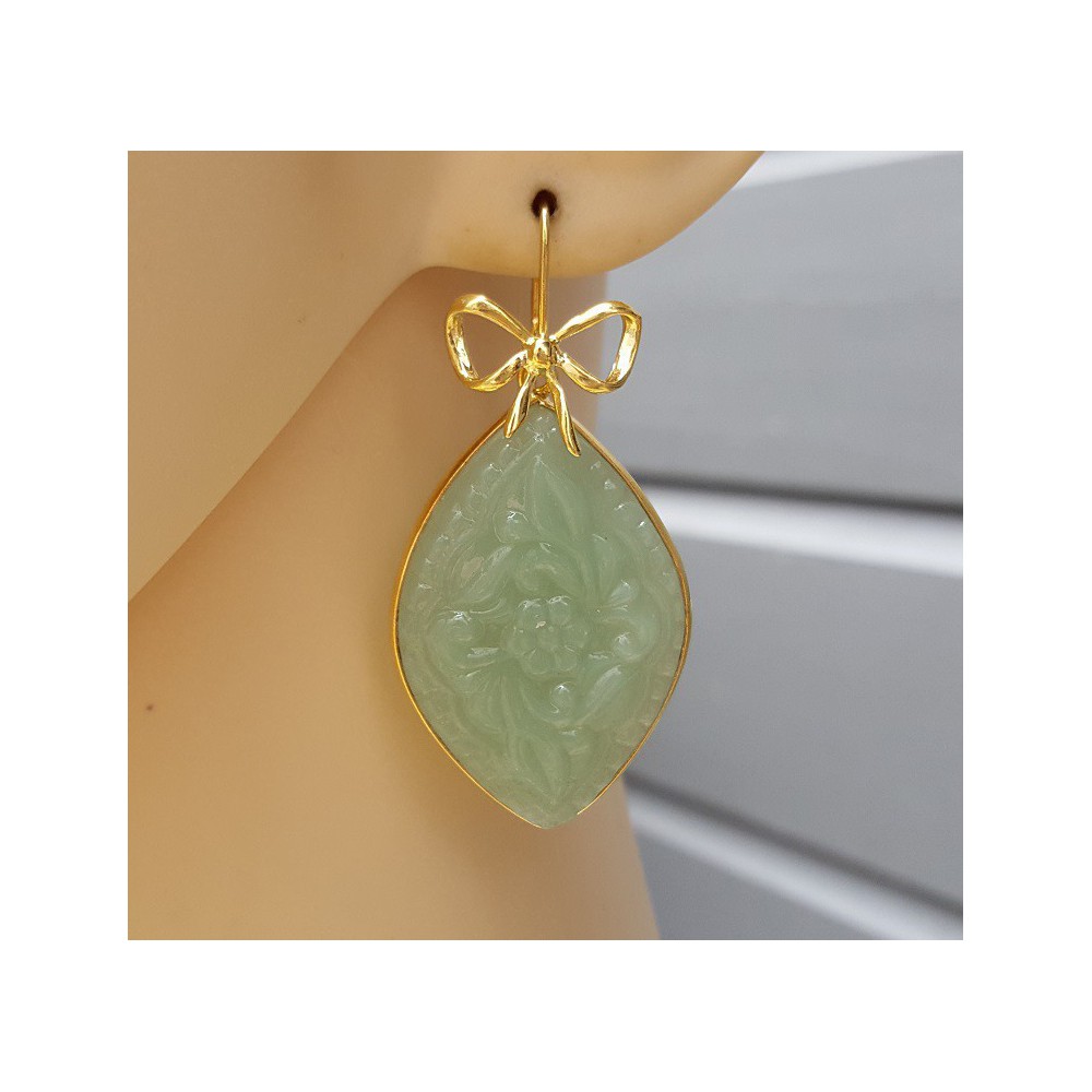 Gold plated earrings with carved light green Chalcedony