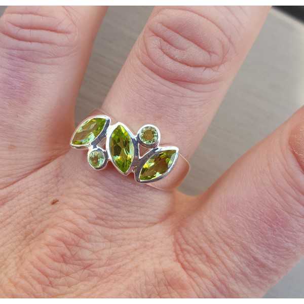 Silver ring set with round and marquise Peridot