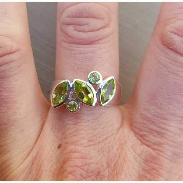 Silver ring set with round and marquise Peridot