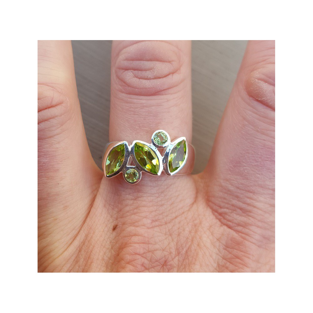 Silver ring set with round and marquise Peridot