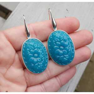 Silver earrings set with oval-cut Chalcedony quartz
