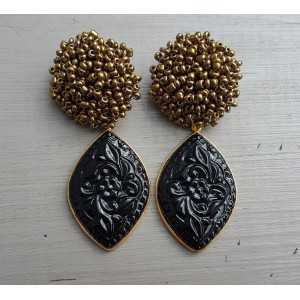Gold plated earrings oorknoppen of beads and carved black Onyx