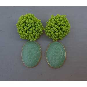 Gold plated earrings oorknoppen of beads and carved green Chalcedony