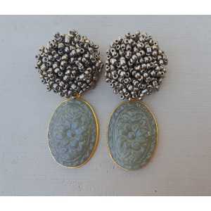 Gold plated earrings oorknoppen of beads and carved grey Chalcedony
