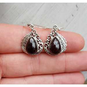 Silver earrings set with Garnet