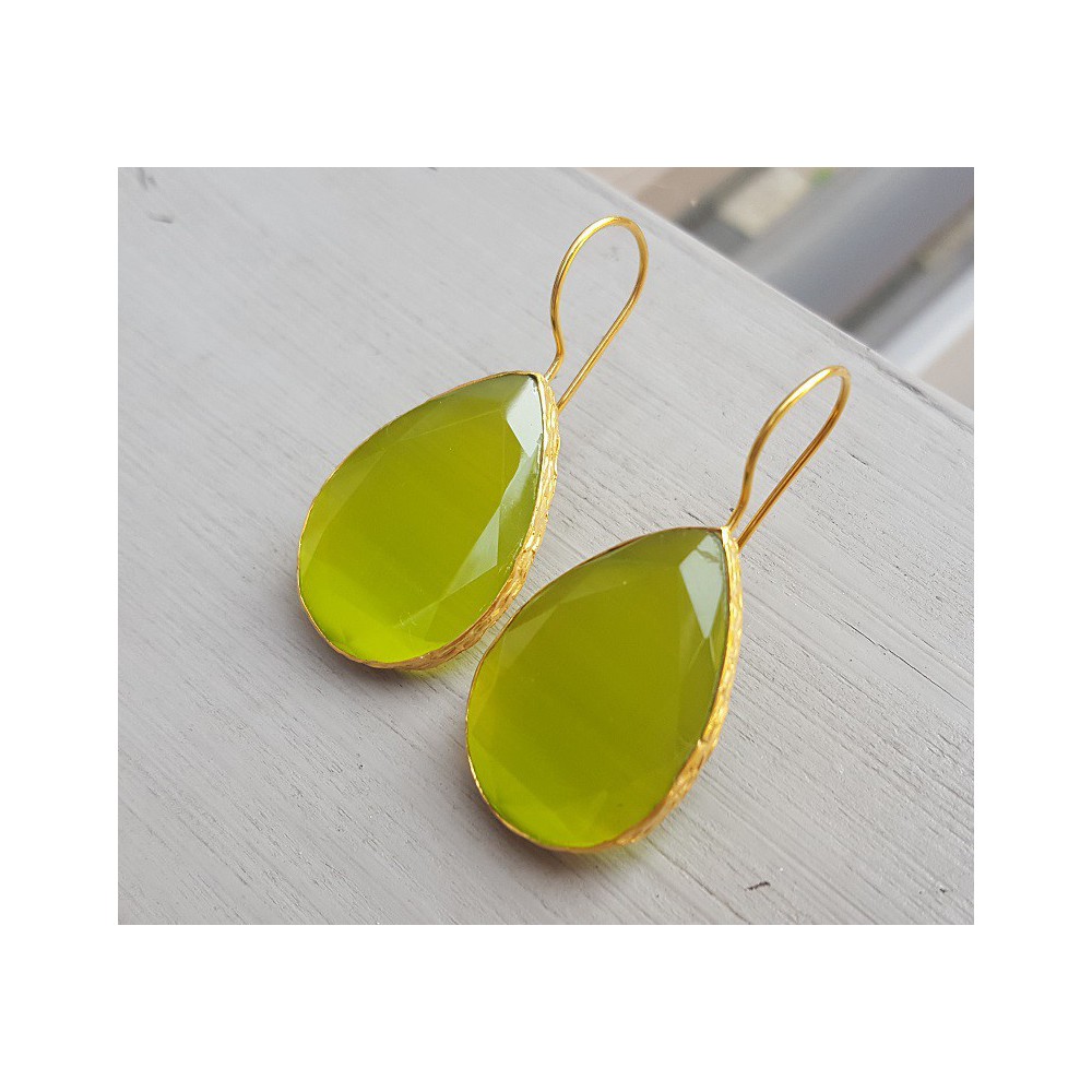 Gold plated earrings with large oval green cats eye