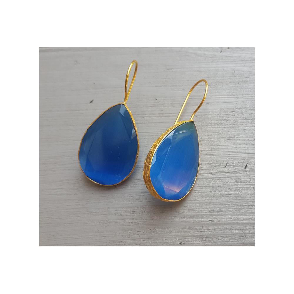 Gold plated earrings with large teardrop blue cat's eye