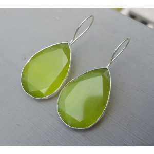 Silver earrings with large oval green cats eye
