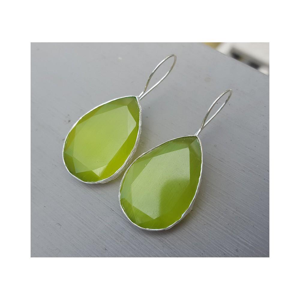 Silver earrings with large oval green cats eye