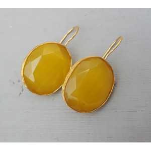 Gold plated earrings set with oval yellow cat's eye