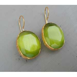 Gold plated earrings set with oval green cats eye