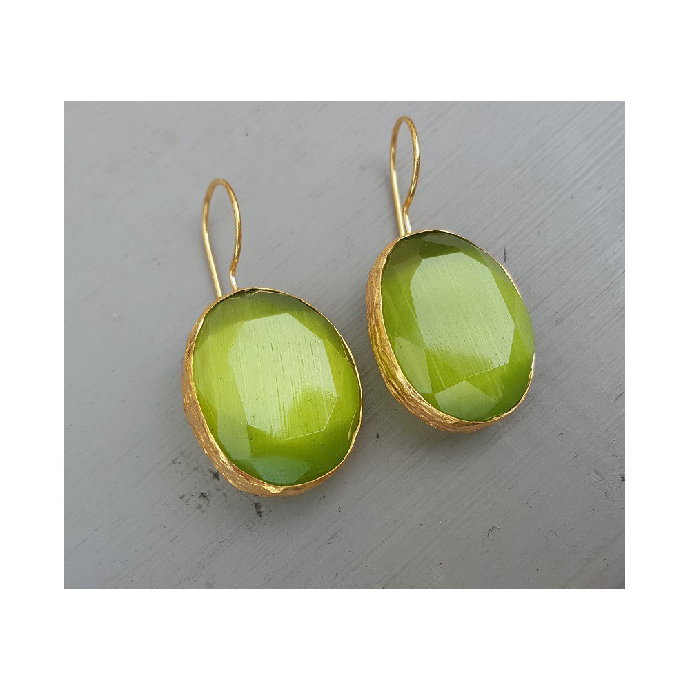 Gold plated earrings set with oval green cats eye