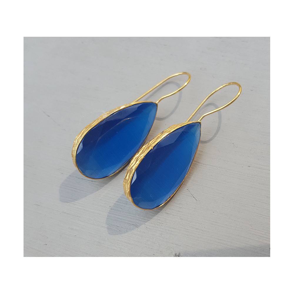 Gold plated earrings set with narrow teardrop blue cat's eye