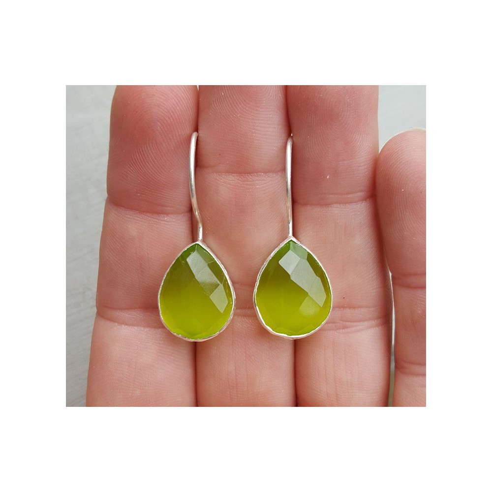 Silver earrings with drop shaped green cats eye