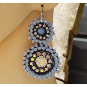 Earrings with pendant of light blue crystals and flower