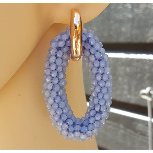 Creolen met grote ovale van licht blauwe Kristallen