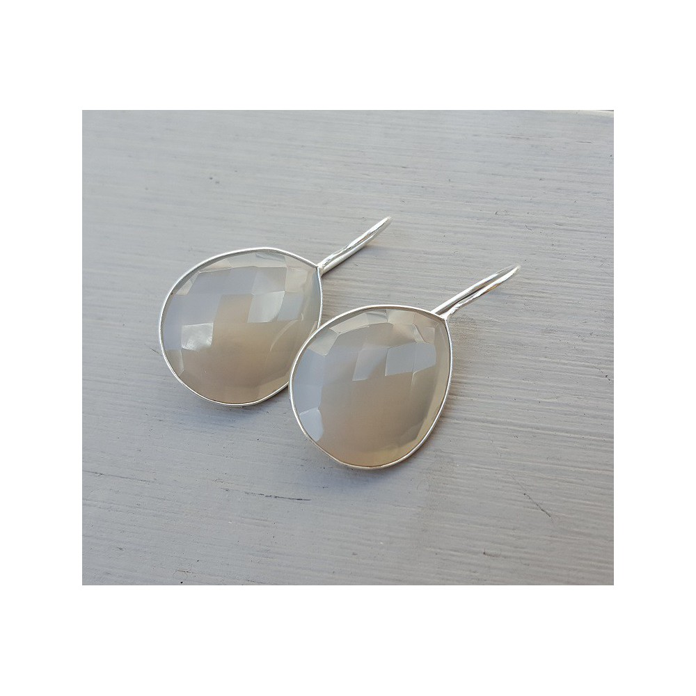 Silver earrings set with teardrop gray Chalcedony