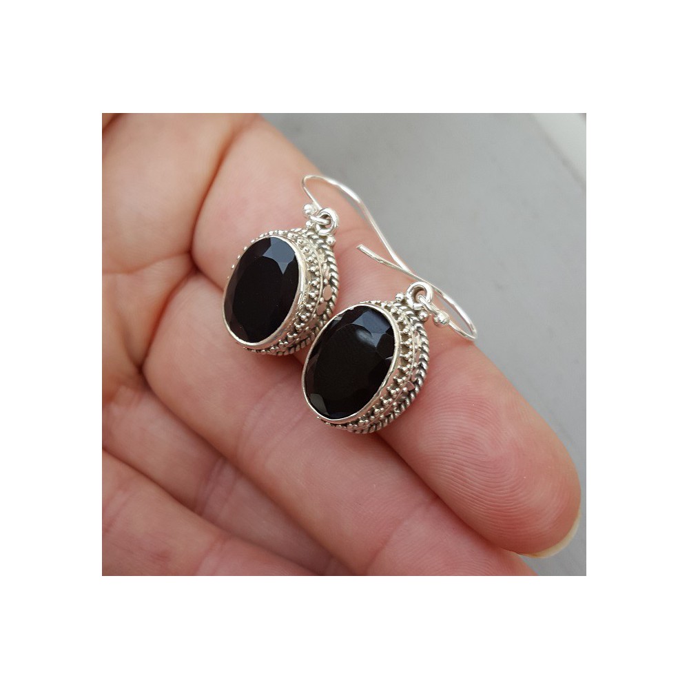 Silver earrings with oval facet black Onyx in the edited setting