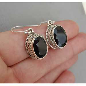 Silver earrings with oval facet black Onyx in the edited setting