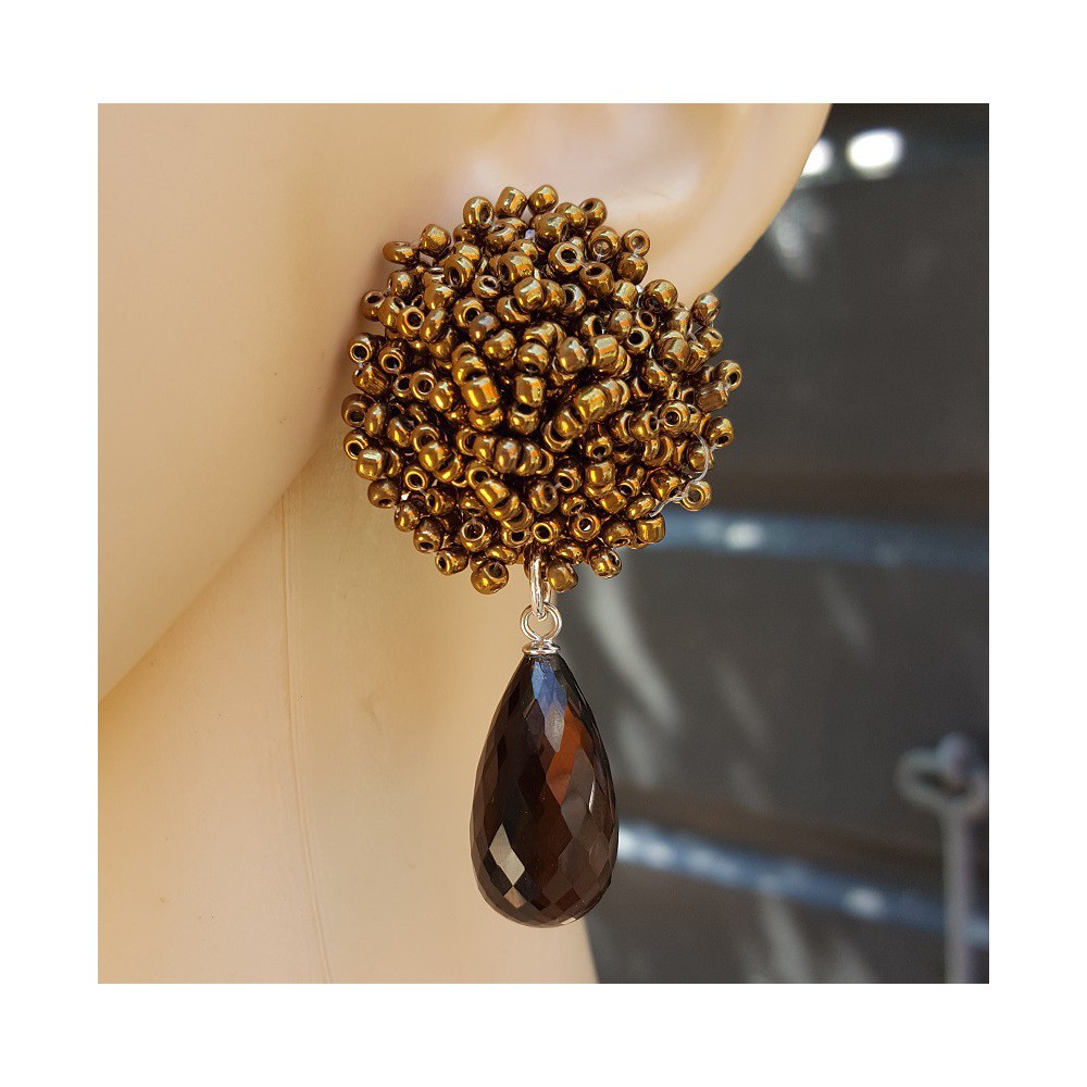 Earrings with oorknoppen of bronze and gold beads and Smokey Topaz