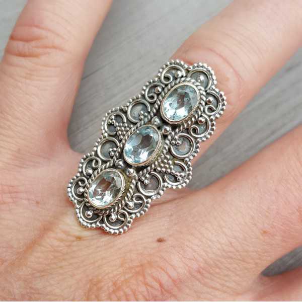 Silver ring set with three blue Topazes 17 mm