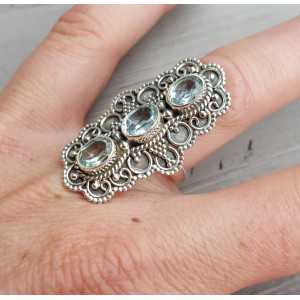Silver ring set with three blue Topazes 17 mm