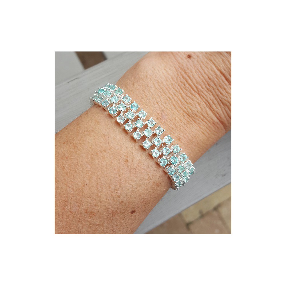 Silver bracelet set with three rows of Apatite