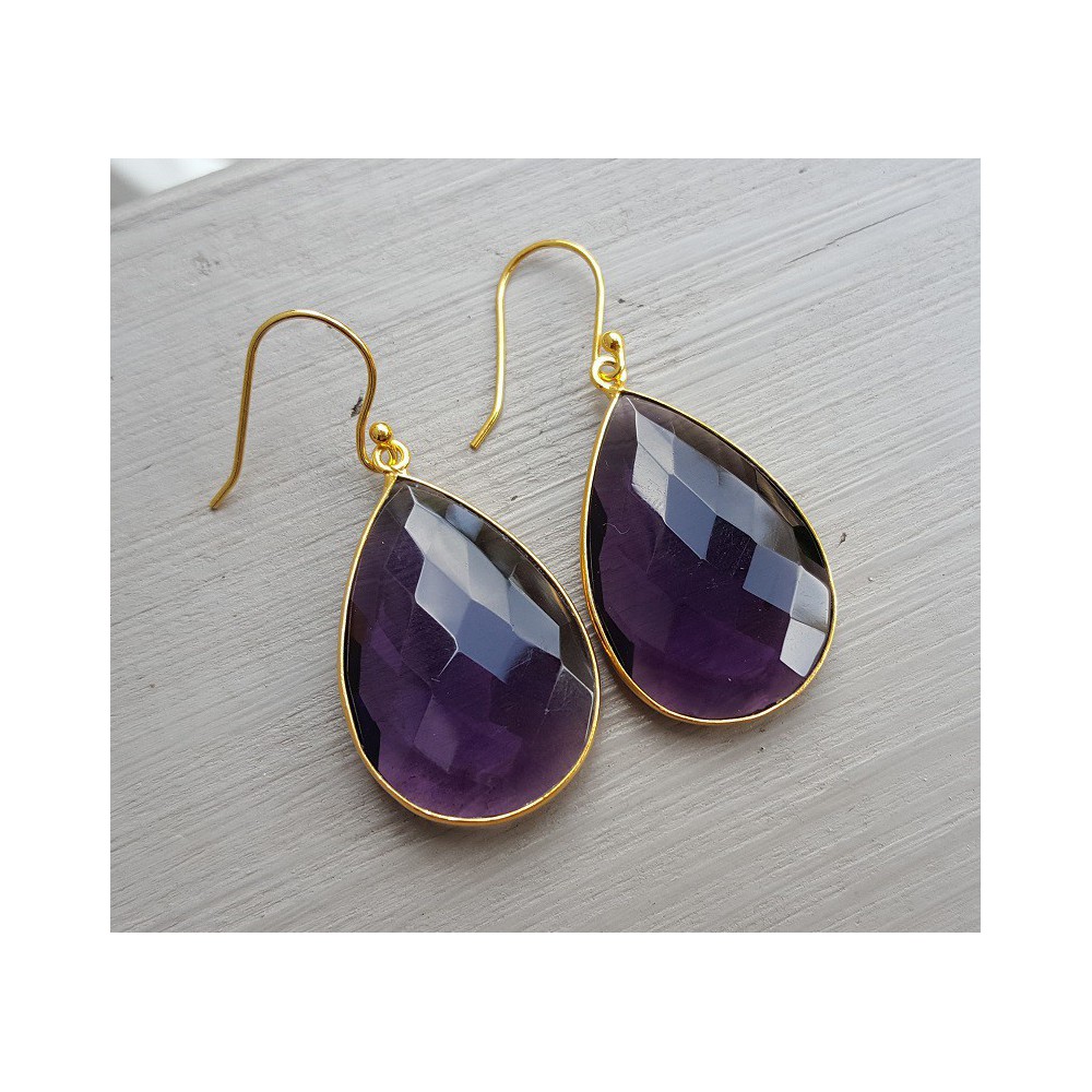 Gold plated earrings set with faceted Amethyst