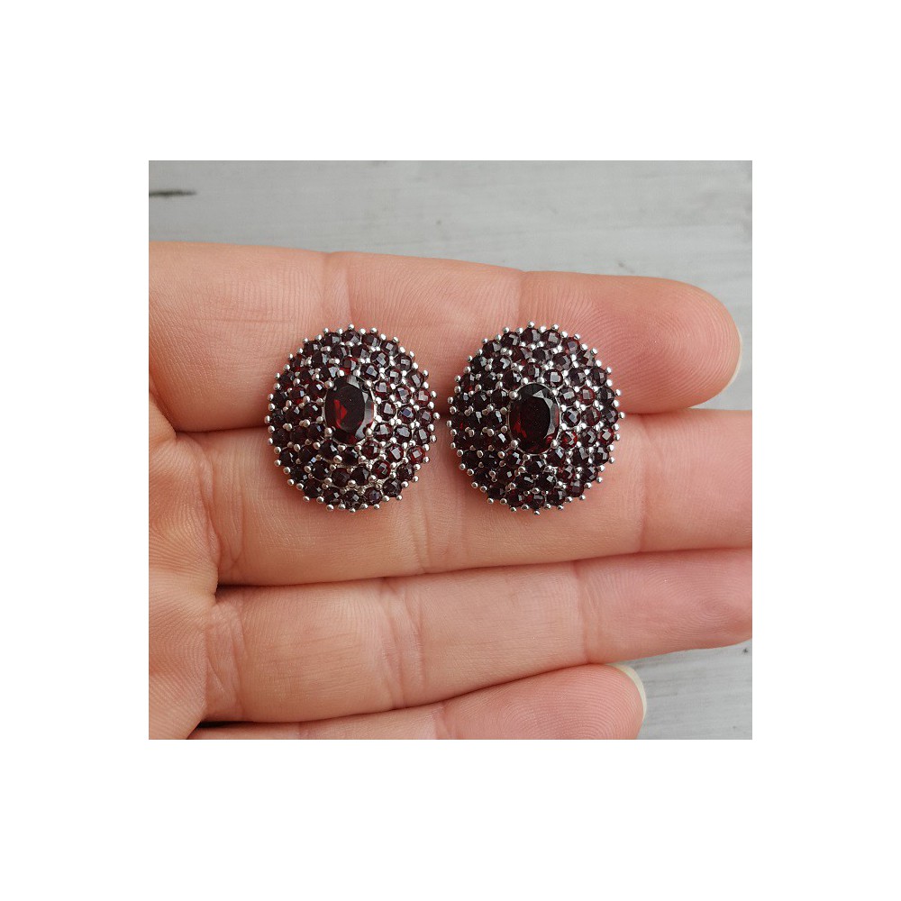 Silver earrings with round and oval faceted Garnets