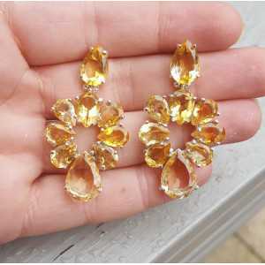 Silver earrings set with oval facet cut Citrine