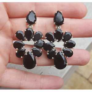 Silver earrings set with facet cut black Onyxen