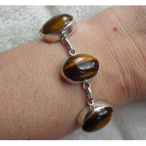 Silver bracelet set with cabochon cut tiger's eye 