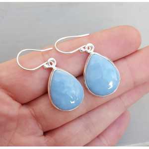 Silver earrings set with teardrop shaped blue Opal