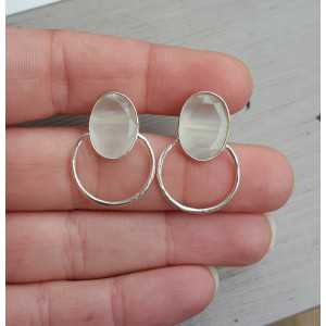 Silver earrings set with oval white cat's eye