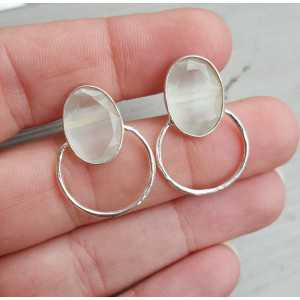 Silver earrings set with oval white cat's eye