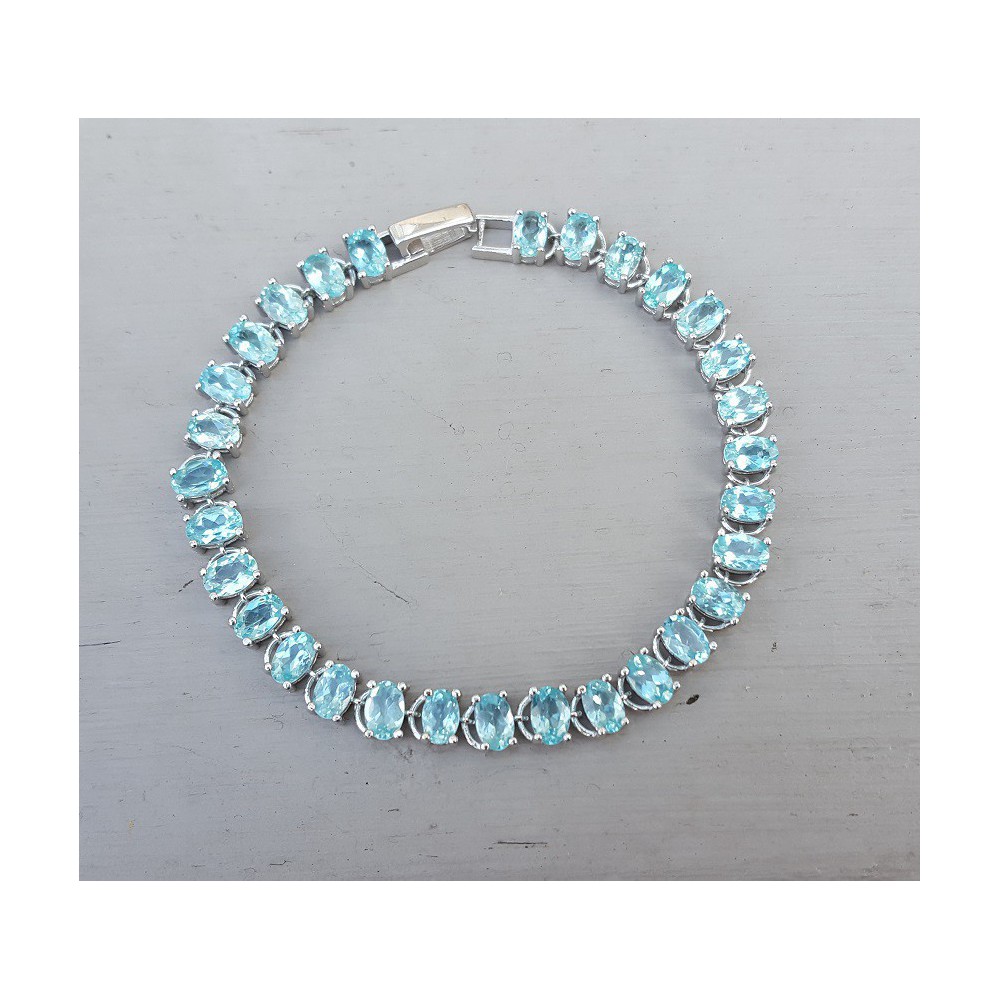 Silver bracelet set with oval facet cut Apatite