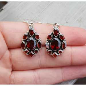 Silver earrings set with faceted Garnets