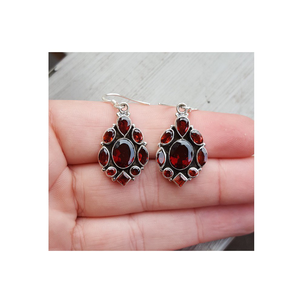 Silver earrings set with faceted Garnets