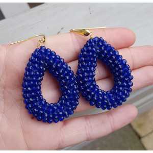 Gold plated earrings with open drop of sapphire blue crystals