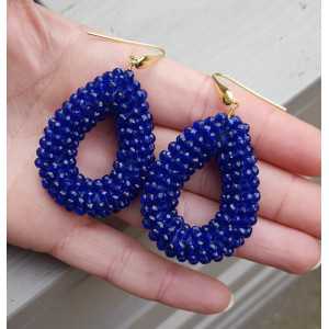 Gold plated earrings with open drop of sapphire blue crystals